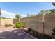 Backyard features a brick wall and decorative flowers at 13521 E Butler St, Chandler, AZ 85225