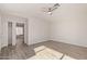 Spacious bedroom with wood-look flooring and a walk-in closet at 13521 E Butler St, Chandler, AZ 85225