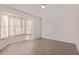 Bright bedroom features updated flooring and a bay window with natural light at 13521 E Butler St, Chandler, AZ 85225