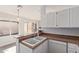 Kitchen featuring white cabinets, wood countertops, and a stainless steel faucet at 13521 E Butler St, Chandler, AZ 85225