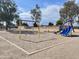 Community playground with swings, slide and climbing features at 13521 E Butler St, Chandler, AZ 85225