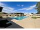 Community pool featuring clear water and covered patio at 13521 E Butler St, Chandler, AZ 85225