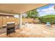 Large outdoor patio with stone, built in barbeque, landscaping and a covered porch at 1375 W Belmont Red Trl, San Tan Valley, AZ 85143