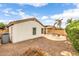An inviting backyard featuring an open patio, gravel, and low maintenance desert landscaping at 1375 W Belmont Red Trl, San Tan Valley, AZ 85143