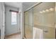 Bright bathroom featuring tiled walk-in shower and natural light at 1375 W Belmont Red Trl, San Tan Valley, AZ 85143