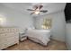 Cozy bedroom with a ceiling fan, dresser, and lots of natural light at 1375 W Belmont Red Trl, San Tan Valley, AZ 85143