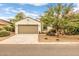 Charming single-story home featuring a neutral color scheme, a two-car garage, and desert landscaping at 1375 W Belmont Red Trl, San Tan Valley, AZ 85143