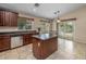Well-equipped kitchen with granite countertops and a kitchen island at 1375 W Belmont Red Trl, San Tan Valley, AZ 85143