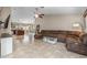 Spacious living room with tile flooring, a ceiling fan, and a comfortable sectional sofa at 1375 W Belmont Red Trl, San Tan Valley, AZ 85143