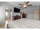 Main bedroom with a TV, walk-in closet, and an ensuite bathroom at 1375 W Belmont Red Trl, San Tan Valley, AZ 85143