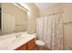 Well lit bathroom with spacious vanity and shower curtain at 16600 N Thompson Peak Pkwy # 2006, Scottsdale, AZ 85260
