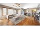 Inviting living room features a plush sectional sofa, ottoman, and hardwood floors at 16600 N Thompson Peak Pkwy # 2006, Scottsdale, AZ 85260