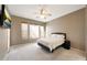 Bedroom with neutral walls, carpet flooring, ceiling fan, and great natural light at 16600 N Thompson Peak Pkwy # 2006, Scottsdale, AZ 85260