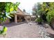 The backyard is beautifully landscaped with desert landscaping, a covered patio, and a view of the house at 1894 E Sagebrush St, Gilbert, AZ 85296