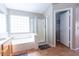 Bright bathroom showcasing a soaking tub, separate shower, and tiled flooring at 1894 E Sagebrush St, Gilbert, AZ 85296