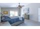 Comfortable bedroom with ceiling fan, gray walls, a dresser, and sliding glass door at 1894 E Sagebrush St, Gilbert, AZ 85296