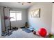 Bright room with lots of workout equipment and a wall decoration at 1894 E Sagebrush St, Gilbert, AZ 85296