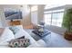 Bright living room features high ceilings, a large window, and stylish contemporary furnishings at 1894 E Sagebrush St, Gilbert, AZ 85296