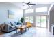 Bright living room with sliding door access to backyard, vaulted ceiling and tile floors at 1894 E Sagebrush St, Gilbert, AZ 85296