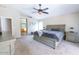 Spacious main bedroom with a ceiling fan, and an ensuite bathroom view at 1894 E Sagebrush St, Gilbert, AZ 85296