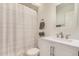 Bright bathroom featuring a vanity with cabinet, light granite counter, and shower at 2035 S Elm St # 211, Tempe, AZ 85282
