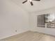 This bedroom features neutral walls, ceiling fan, and a window with wood-look laminate flooring at 2035 S Elm St # 211, Tempe, AZ 85282