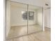 Mirrored closet doors open to show an empty closet at 2035 S Elm St # 211, Tempe, AZ 85282
