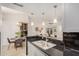 Open concept kitchen with granite countertops, stainless steel appliances, and seamless flow to the dining area at 2035 S Elm St # 211, Tempe, AZ 85282