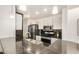 Well-lit kitchen featuring modern appliances, dark countertops, and white cabinetry at 2035 S Elm St # 211, Tempe, AZ 85282