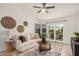 Comfortable living room with a neutral color palette, a decorative rug, and a sliding door to a patio at 2035 S Elm St # 211, Tempe, AZ 85282