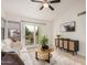 Cozy living room with a sliding glass door leading to a balcony, and a decorative console table at 2035 S Elm St # 211, Tempe, AZ 85282