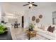 Inviting living room with open floorplan to the dining area, featuring a modern console and comfortable seating at 2035 S Elm St # 211, Tempe, AZ 85282