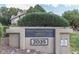 Community sign, 'Spring Tree', with address and surrounding greenery at 2035 S Elm St # 211, Tempe, AZ 85282