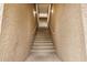 Outdoor stairway leading to upper-level units with textured walls and natural lighting at 2035 S Elm St # 211, Tempe, AZ 85282
