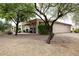 Secluded covered patio with lush landscaping, offering a serene outdoor retreat at 20669 N 266Th Ave, Buckeye, AZ 85396