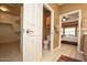 Bathroom view showcasing toilet, walk-in closet, and Primary bedroom entrance at 20669 N 266Th Ave, Buckeye, AZ 85396