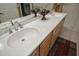 Bathroom featuring double sinks, chrome faucets, and neutral countertops at 20669 N 266Th Ave, Buckeye, AZ 85396