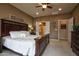 Cozy bedroom featuring a large bed, recessed lighting, and adjacent bathroom at 20669 N 266Th Ave, Buckeye, AZ 85396