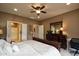 Inviting bedroom showing a ceiling fan, recessed lighting, and dresser with mirror at 20669 N 266Th Ave, Buckeye, AZ 85396