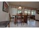 Cozy dining area with views from sliding glass doors and wooden dining set at 20669 N 266Th Ave, Buckeye, AZ 85396