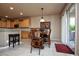 Open dining area with wood table and seating conveniently located near the kitchen at 20669 N 266Th Ave, Buckeye, AZ 85396
