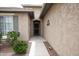 Inviting front entrance with desert landscaping, neutral colors and security screen door at 20669 N 266Th Ave, Buckeye, AZ 85396