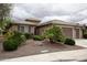 Charming home exterior with a two-car garage and desert landscaping at 20669 N 266Th Ave, Buckeye, AZ 85396