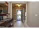 Welcoming foyer with tile flooring, a console table, and view of the front door at 20669 N 266Th Ave, Buckeye, AZ 85396