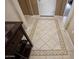 Foyer with decorative tile inlay, console table, and view of entryway at 20669 N 266Th Ave, Buckeye, AZ 85396