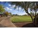 Scenic view of a well-maintained golf course with mountain views at 20669 N 266Th Ave, Buckeye, AZ 85396