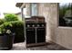 Stainless steel outdoor grill with sleek black cabinets is conveniently located outside at 20669 N 266Th Ave, Buckeye, AZ 85396