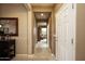 Entrance hallway leading to an open living area with stylish furnishings at 20669 N 266Th Ave, Buckeye, AZ 85396