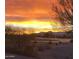 Picturesque view of a sunset over a golf course community at 20669 N 266Th Ave, Buckeye, AZ 85396