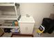 This laundry room features a utility sink with a white cabinet, perfect for home tasks and cleaning at 20669 N 266Th Ave, Buckeye, AZ 85396